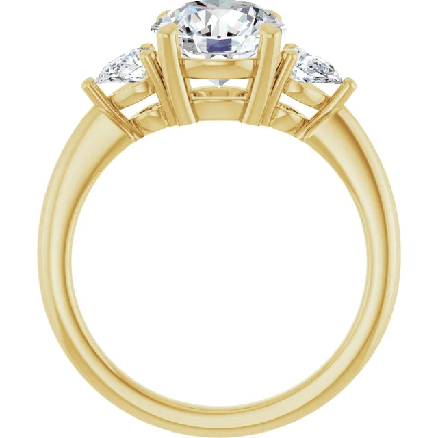 Round and Pear 3 Stones Engagement Ring showing under gallery