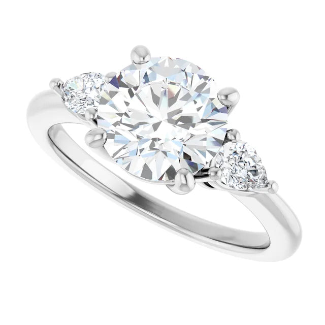 Round and Pear 3 Stones Engagement Ring in Platinum